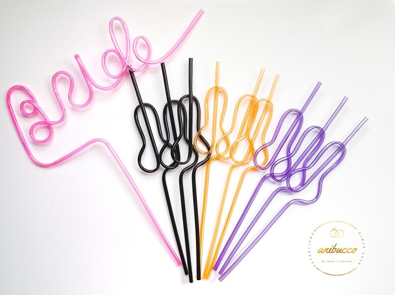 May include: A set of colorful plastic straws shaped into different designs. One straw is shaped to spell out "bride" in pink, while the others are shaped like a hand with the index and pinky fingers extended.