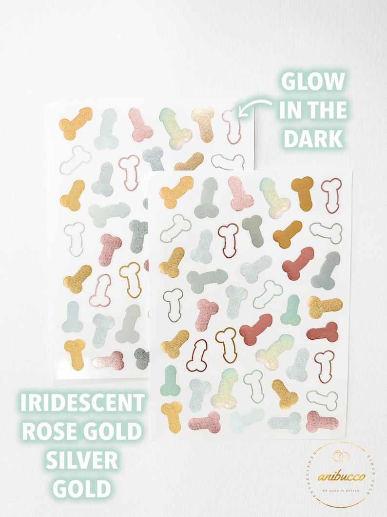 May include: A sheet of iridescent stickers featuring a repeating pattern of a single, stylized, anatomical heart shape. The stickers are in rose gold, silver, and gold colors. The text "Glow in the Dark" is written on the sheet. The text "Iridescent Rose Gold Silver Gold" is written below the sheet.