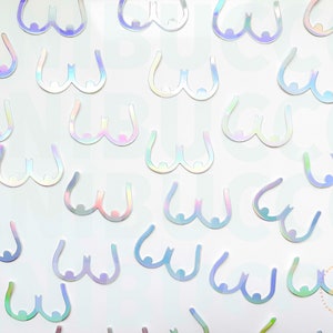 May include: A sheet of iridescent holographic stickers in the shape of breasts. The stickers are white with a rainbow sheen.