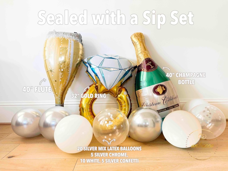 May include: A festive balloon set includes a 40-inch flute, a 32-inch gold ring, and a 40-inch champagne bottle. The set also features silver and white latex balloons, some with confetti. The text "Sealed with a Sip Set" is visible.