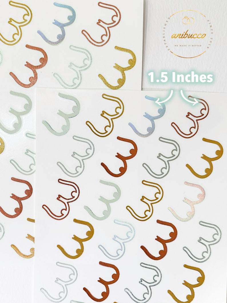 May include: A sheet of stickers with a repeating pattern of 1.5 inch gold, silver, and copper colored breast outlines. The stickers are on a white background.