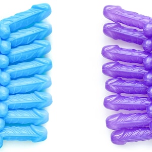 May include: A set of 12 blue and purple plastic straws with a decorative arrowhead design. The straws are arranged in two rows, with the blue straws on the left and the purple straws on the right. The text "BLUE" and "PURPLE" is printed above each row of straws.