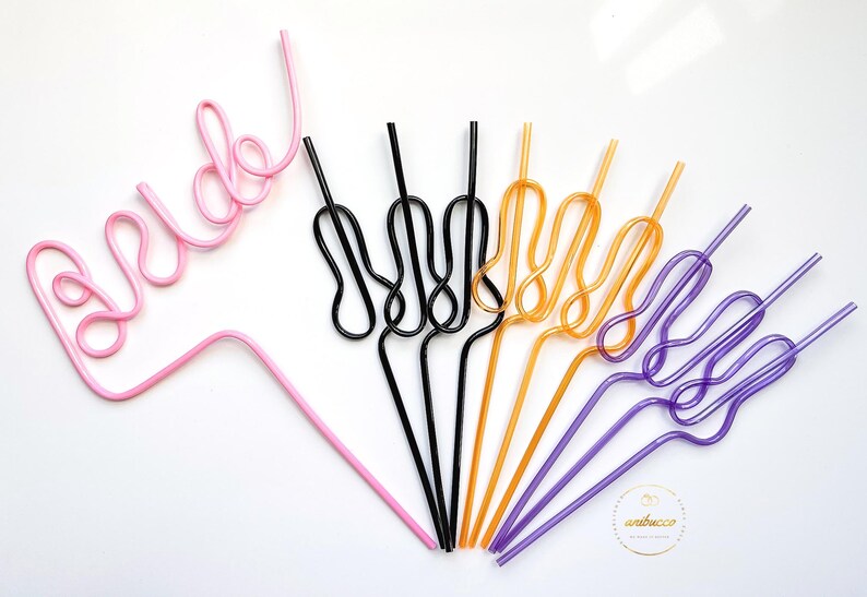 May include: A set of colorful, bendable drinking straws. The straws are shaped into different designs, including the word "bride" in pink. The straws are perfect for adding a fun touch to any party or event.