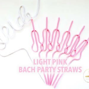 May include: Light pink and white straws for a bachelorette party. The word "bride" is written in white, curly script. The text "LIGHT PINK BACH PARTY STRAWS" is in pink. The straws are on a white background.