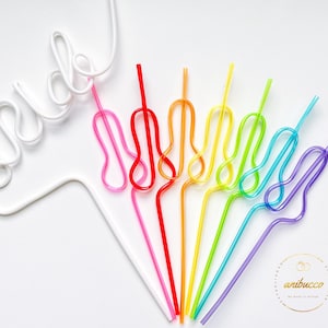 May include: A set of rainbow colored reusable drinking straws with a white plastic straw shaped into the word "bride".