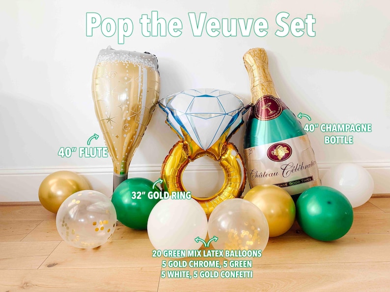May include: A festive party decoration set labeled "Pop the Veuve Set" includes a 40-inch champagne flute, a 32-inch gold ring, and a 40-inch champagne bottle balloon. The set also features gold, green, white, and confetti balloons.
