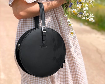 Structured circle crossbody bag. Black leather round bag