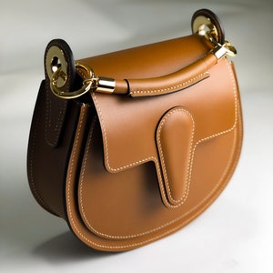 Brown leather crossbody saddle bag