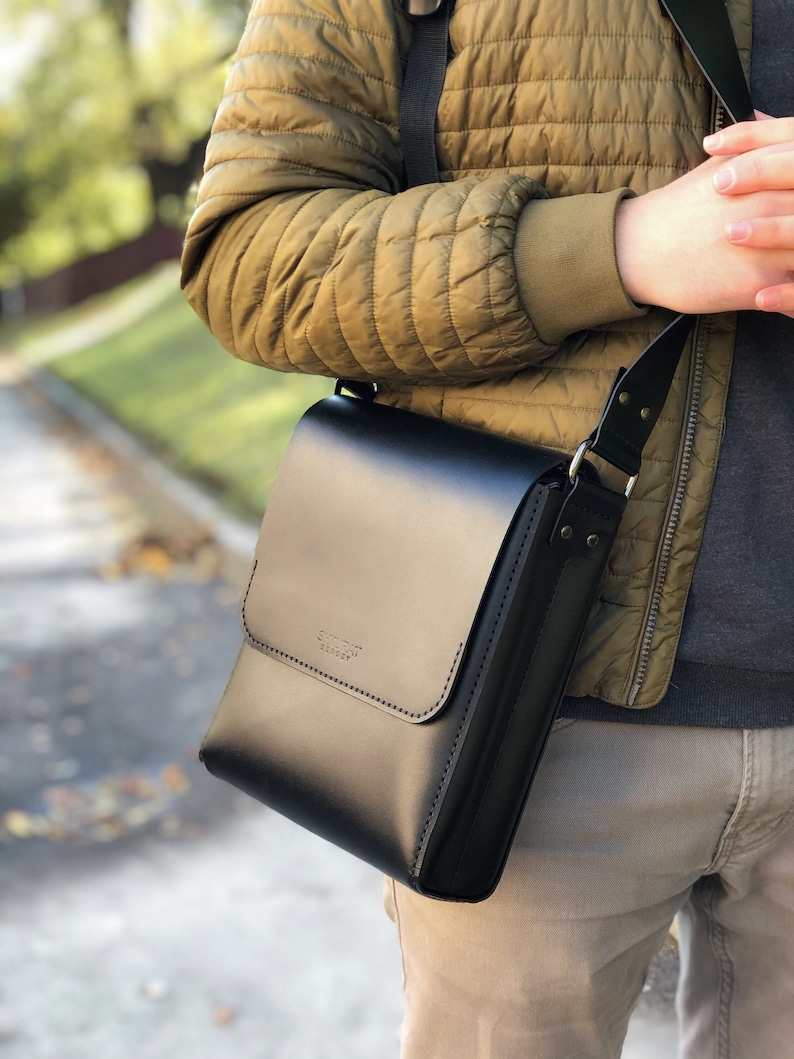 Mens mini messenger bag. Black leather shoulder bag image 1