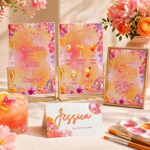 May include: A set of printed event stationery featuring a watercolor design with orange slices, pink flowers, and disco balls. Includes two vertical menu signs, one vertical paint station sign, and one horizontal place card with the name Jessica.