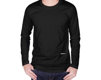 May include: A plain black long-sleeved top with a crew neck. The shirt is a simple design. The model is wearing blue jeans. The shirt is made of a soft, comfortable material.