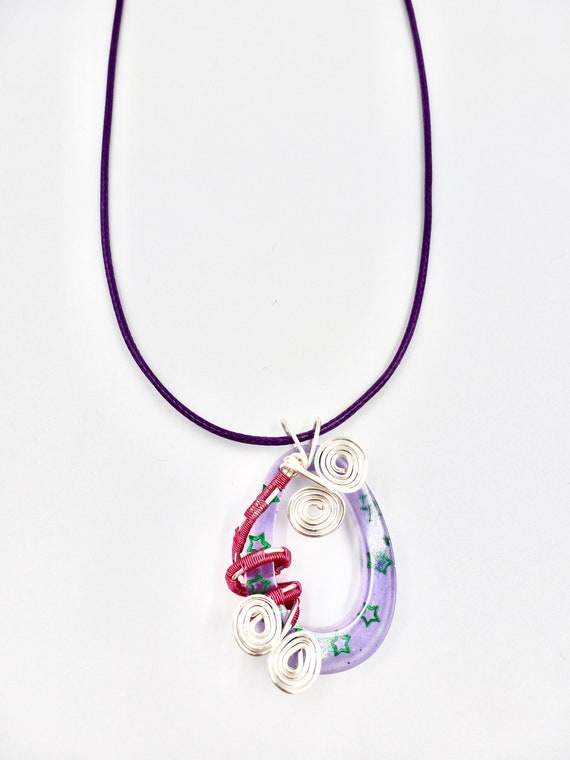 Purple Resin Green Star Sparkle Pendant With Wire Wrapped Detail Purple Cord Necklace by Lauren Jay Designs