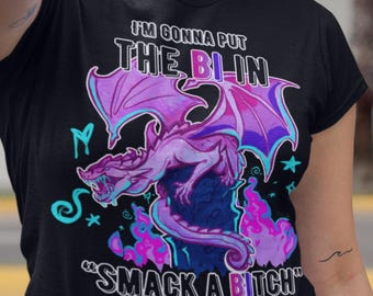May include: Black t-shirt featuring a purple and pink dragon graphic with the text "I'M GONNA PUT THE BLIN" and "SMACK A BITCH". The shirt is paired with a black skirt.