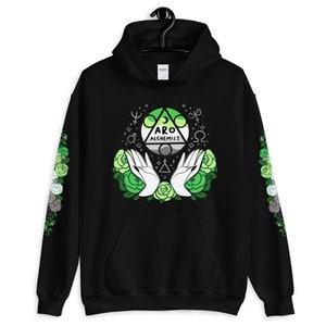 May include: Black hoodie with a green, gray, and white aro symbol with the text "Aro Alchemist" surrounded by green roses and white hands. The sleeves have a floral pattern in green, gray, and white.
