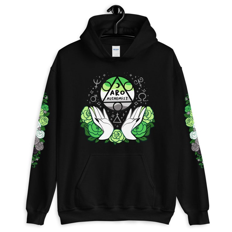 May include: Black hoodie with a green, gray, and white aro symbol with the text "Aro Alchemist" surrounded by green roses and white hands. The sleeves have a floral pattern in green, gray, and white.
