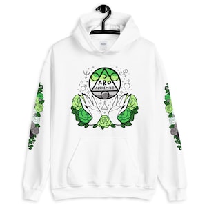 May include: White hoodie with a green, gray, and white aro alchemist symbol with a green and white floral design on the front and sleeves. The symbol has the text "Aro Alchemist" inside.