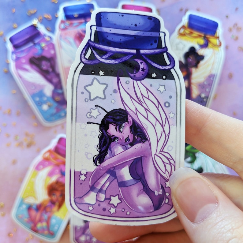 May include: A purple glass bottle sticker with a fairy inside. The fairy has purple wings and is sitting on a bed of purple and white stars. The bottle is decorated with a purple rope and a silver moon.