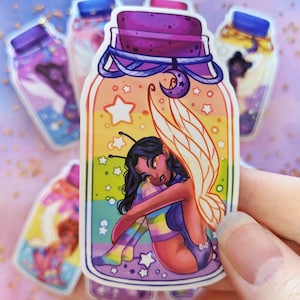 May include: A sticker of a glass jar with a purple lid and a fairy with rainbow wings inside. The jar is filled with a rainbow-colored liquid and stars. The fairy is sitting on a cloud with her wings spread out.