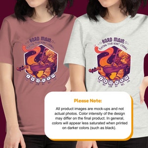 May include: A pink and a gray t-shirt with a graphic of a woman playing a violin. The graphic includes the text "Bard Main" and "Playing Your Heart Strings". The graphic also includes a D&D character sheet with stats for Strength, Dexterity, Constitution, Intelligence, Wisdom, and Charisma.