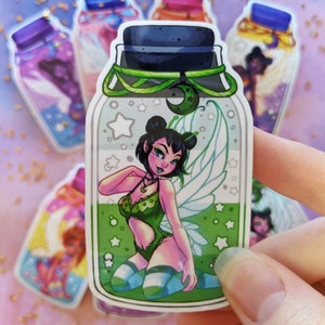 May include: A green glass bottle sticker with a fairy inside. The fairy has green wings, a green and white outfit, and blue and white striped stockings. The bottle has a green lid and a white background with stars and a crescent moon.