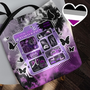 May include: A purple tote bag with a Rockerpunk Rogue Starter Pack design. The bag features a graphic of various items, butterflies, and the text "ATTITUDE INCLUDED!". The background has a tie-dye effect with black accents.