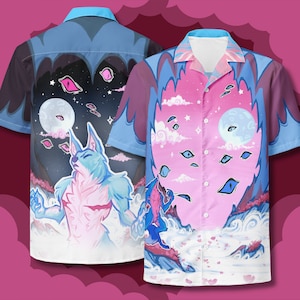 May include: Two blue and pink patterned button-up shirts with a wolf design. The shirt on the left has a dark blue background with a wolf howling at the moon. The shirt on the right has a pink background with a wolf howling at the moon and clouds.