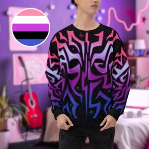 May include: Black crew neck sweatshirt with a vibrant, abstract design in shades of pink, purple, and blue. The sweatshirt features a repeating pattern of stylized shapes. A circular graphic with pink, white, black, and blue stripes is in the upper left corner.
