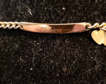 Baby bracelet that is engraved "Alexis"