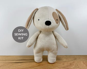 May include: DIY sewing kit for making a plush dog toy. The dog is beige with brown spots and black eyes. The kit includes all the materials needed to sew the dog.