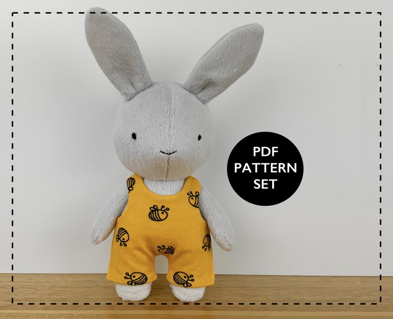 May include: A grey plush bunny wearing a yellow jumpsuit with a black bee pattern. The text "PDF PATTERN SET" is visible in a black circle.