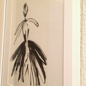 May include: A black and white ink drawing of a person in a dress. The drawing is framed and has a white mat.
