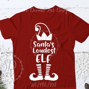 May include: A red t-shirt with a white graphic that reads "Santa's Loudest ELF." The design includes an elf hat, a wreath, and elf feet. The bottom of the shirt has the text "SVG/PNG/DXF."