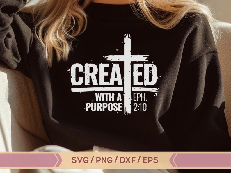 May include: A black sweatshirt with a white graphic design that says "CREATED WITH A PURPOSE EPH. 2:10". The graphic includes a white cross with a distressed look.
