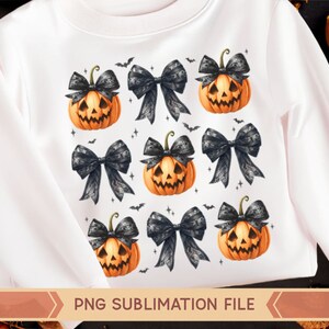 May include: White sweatshirt with a repeating pattern of black bows and orange jack-o'-lantern pumpkins. The text "PNG SUBLIMATION FILE" is printed at the bottom of the sweatshirt.