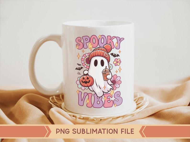 May include: White ceramic mug with a pink and purple design featuring a ghost holding a pumpkin and a cup of coffee. The text "Spooky Vibes" is written in pink and purple letters.