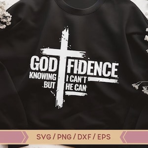 May include: Black sweatshirt with a white graphic design of a cross with the text "GOD FIDENCE" and the phrase "Knowing but I can't he can".