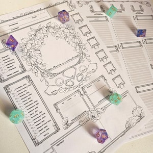 May include: A printable Dungeons and Dragons character sheet with a floral design. The sheet includes sections for character stats, skills, attacks, and spells. There are also several dice in the image, including a blue d20, a green d20, and a purple d6.