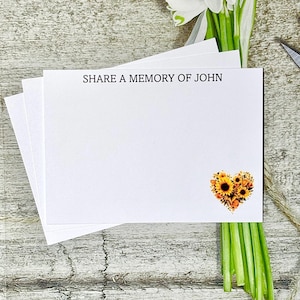 May include: White cards with the text "SHARE A MEMORY OF JOHN" printed at the top. A sunflower heart design is printed at the bottom of the cards.