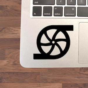 May include: Black and white sticker of a stylized wheel with five spokes. The wheel is in a curved shape, as if it is rolling.