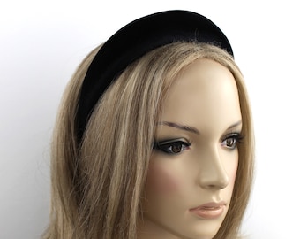 May include: A wide black velvet headband for women. The headband is made of soft, comfortable velvet and is perfect for adding a touch of elegance to any outfit.