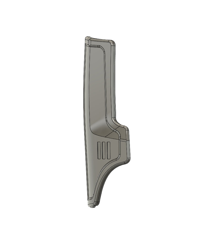 May include: A gray plastic automotive part with a curved shape and three rectangular openings. The part is designed to fit into a vehicle's interior.
