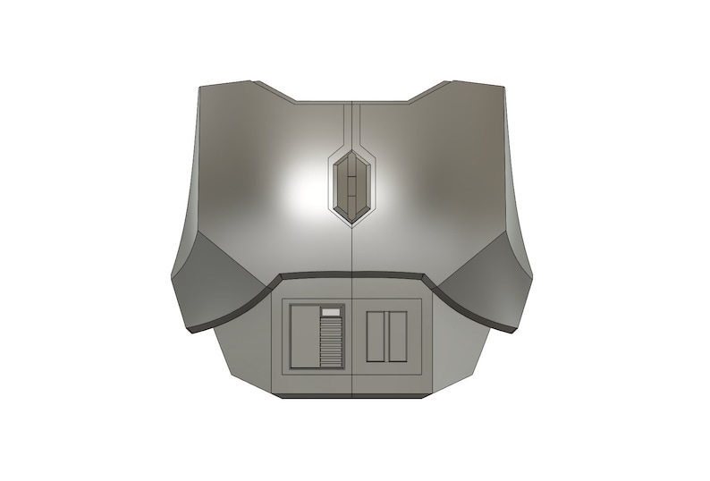 Puede incluir: Una pieza de pecho de color plateado, de aspecto futurista, con un panel en forma de diamante en el centro y dos paneles rectangulares debajo.