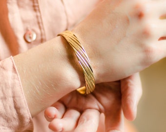 Gold bangle bracelet for women by Monet jewelry