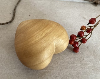 small wooden heart heart hand flattering cherry tree