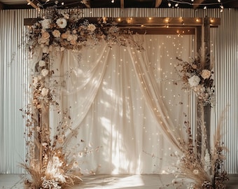 May include: A rustic wooden wedding arch decorated with dried flowers and greenery, draped with sheer white fabric and twinkling fairy lights.
