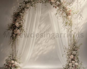 May include: A white fabric backdrop with a floral archway made of white and pink flowers. The archway is made of metal and is decorated with greenery.