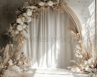 May include: A white and beige floral archway with dried flowers and pampas grass. The archway is decorated with white fabric and is set against a white wall.