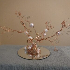 Small, decorative wire trees; perfect for the finishing touch on your wedding cake, and doubling as a pretty decoration after the big day!