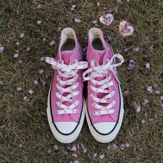 white shoes with pink shoelaces