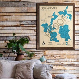 May include: A framed map of the Fence Lake Chain in Vilas County, Wisconsin. The map shows the outlines of several lakes in blue, with names and depths labeled. The map is surrounded by a brown frame.